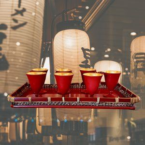 VINTAGE SAKE SET WITH SEVEN CUPS AND BAMBOO TRAY